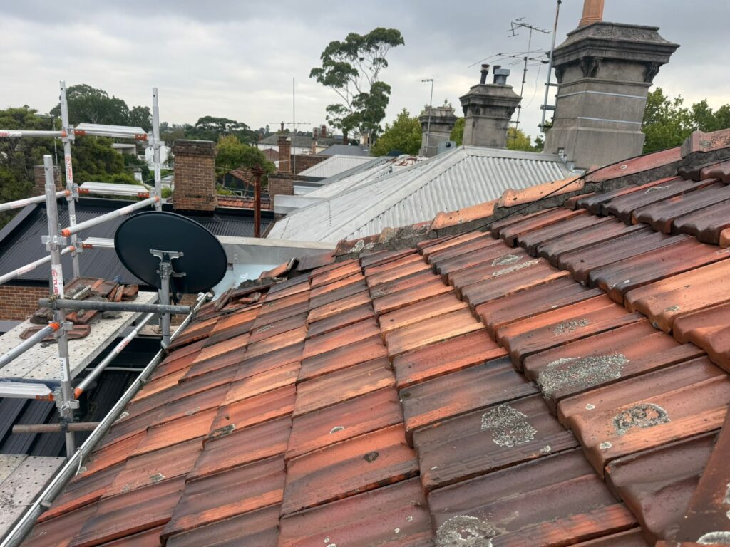 Roof Replacement Melbourne 3 Terracotta roof with temporary safety rail and scaffold in place
