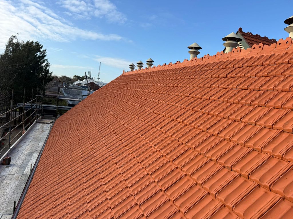 Tiled roof with neatly rebedded and pointed ridge capping