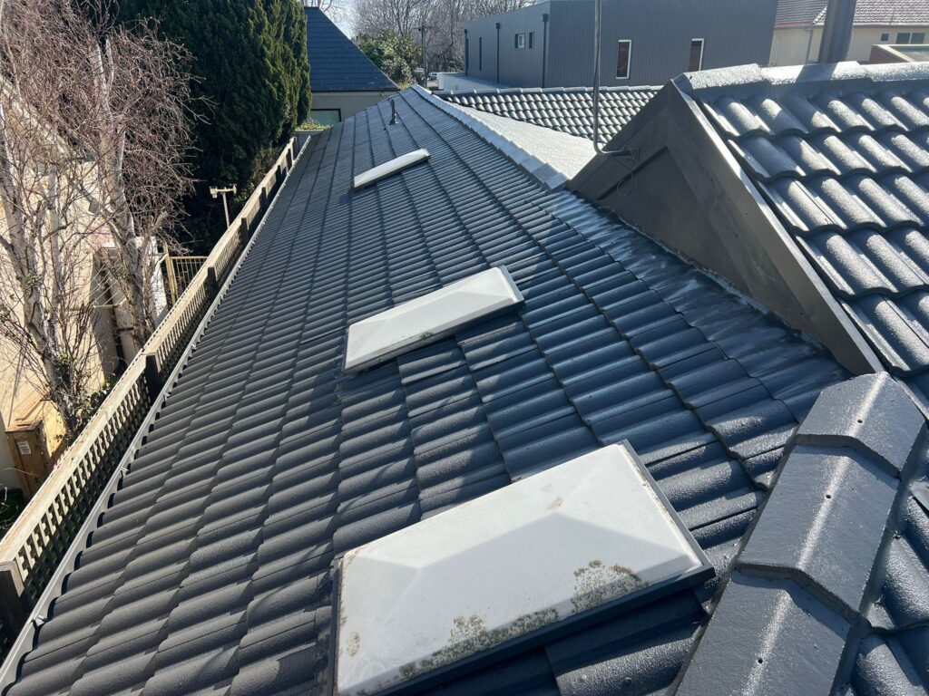 Roof Painting Melbourne 3 Charcoal recoated concrete tile roof with skylights in Brighton