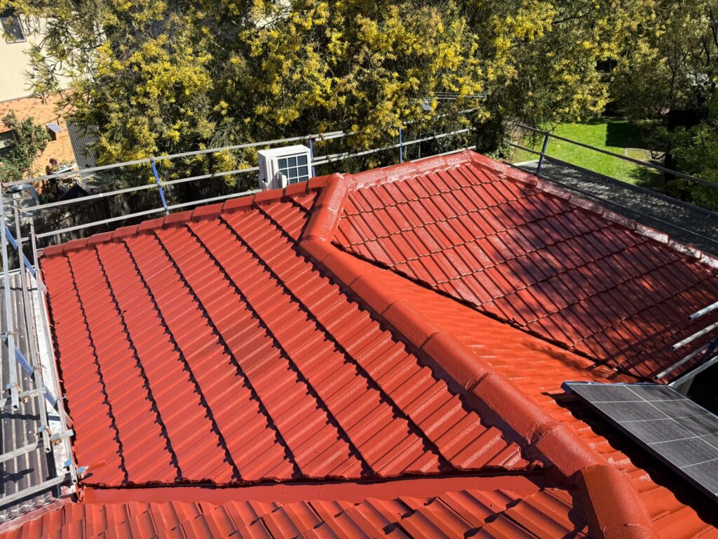 Roof Painting Melbourne 4 Concrete tile roof recoated in red with safety rail